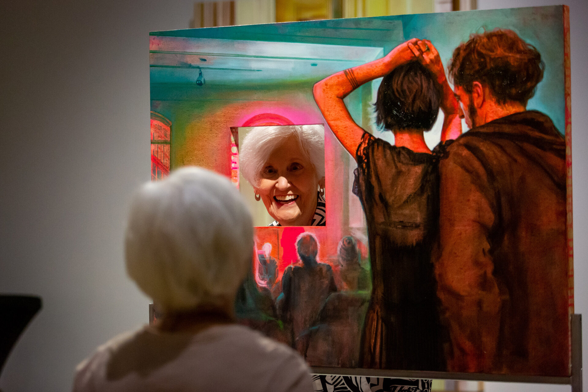 Senior woman looking at artwork