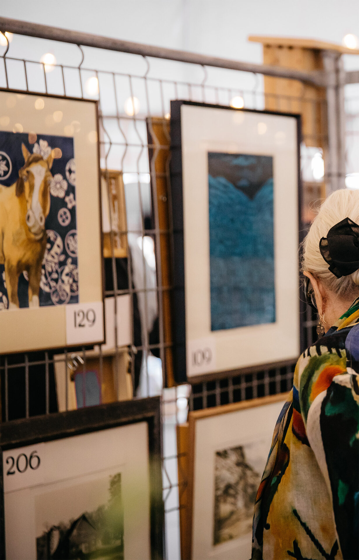 Guests looking at artwork on display